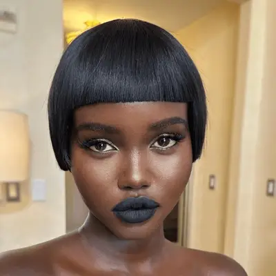 Adut Akech with a modern day pageboy hairstyle