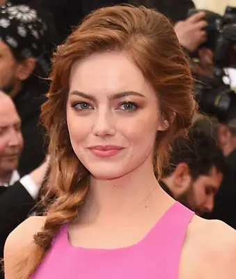 Emma Stone with a side braided hairstyle.