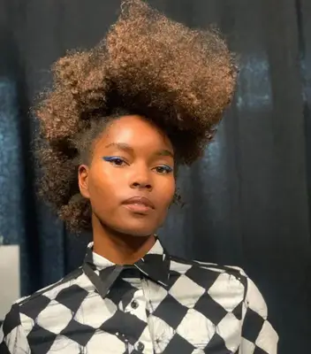 Woman with voluminous natural frohawk