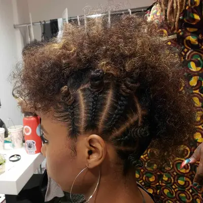 Curly fauxhawk with bantu knots