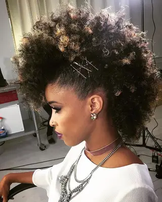 Voluminous, pinned curly fauxhawk