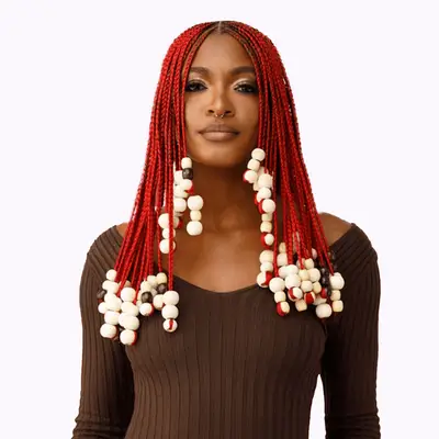 model wearing Slayyy Hair red braiding hair with beads
