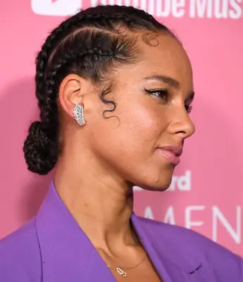 Alicia Keys cornrows and low braided bun