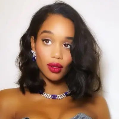 Laura Harrier wears voluminous shoulder-length wavy hair