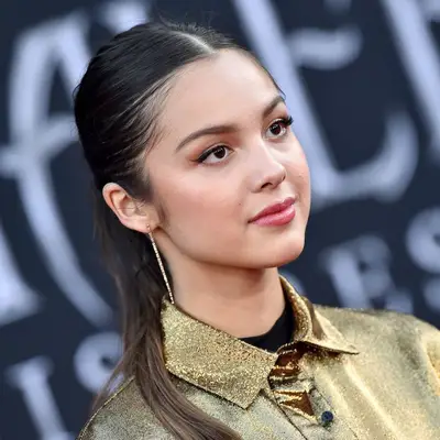 Olivia Rodrigo wears a sleek, elevated ponytail hairstyle