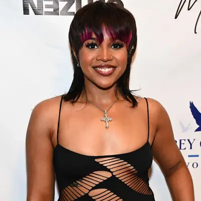 Alex Vaughn with a mullet and pink peek-a-boo bangs