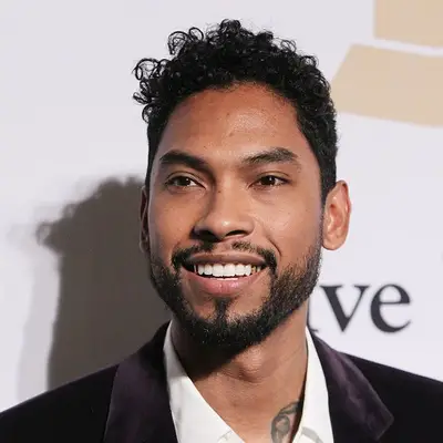 Miguel with a curly pompadour