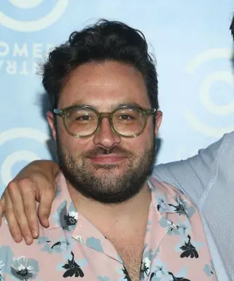 Eliot Glazer with a curly quiff