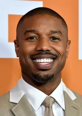 Michael B. Jordan with a pencil mustache and a fade