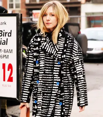Woman with bangs walking in street