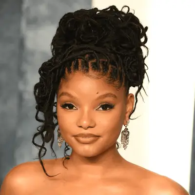 Halle Bailey wearing her locs in a bun