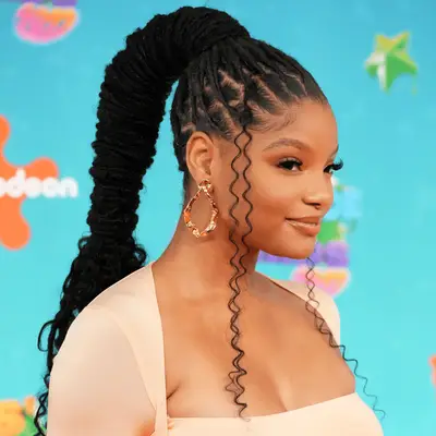Halle Bailey wearing wrapped loc high ponytail