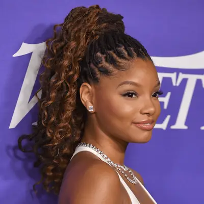 Halle Bailey wearing curly ponytail