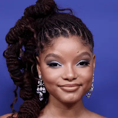 Halle Bailey wearing her locs in a side ponytail