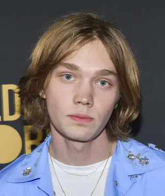 Charlie Plummer with curtain bang hairstyle