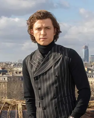 Tom Holland with long wavy hair 