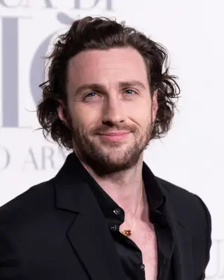 Aaron Taylor-Johnson with wavy hair 