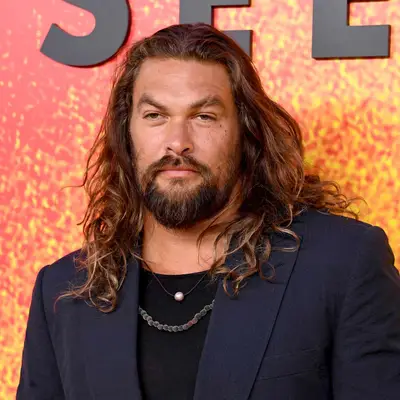 Jason Mamoa with long wavy hair 