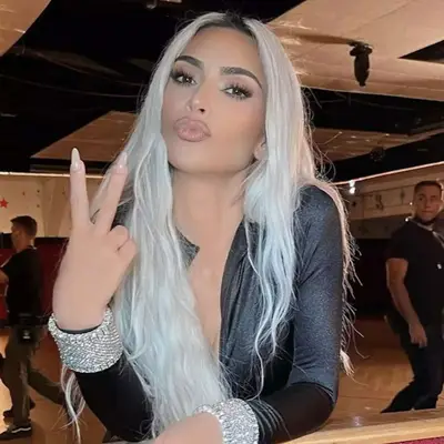Kim Kardashian with long, wavy, icy blonde hair
