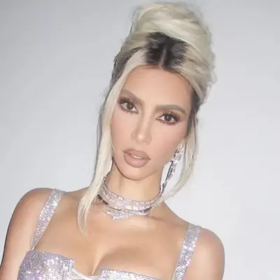 Kim Kardashian with blonde rooty updo