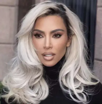 Kim Kardashian with loose, retro blonde blowout