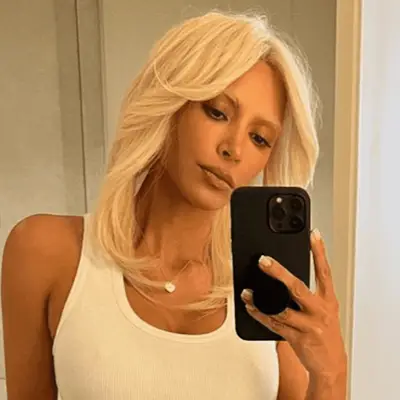 Kim Kardashian in loose waves and a long, retro-inspired bang at the 2024 Vanity Fair Oscar Party in Beverly Hills, California 