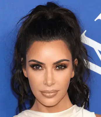Kim Kardashian with a sleek bun at the 2022 Baby2Baby Gala in Los Angeles, California