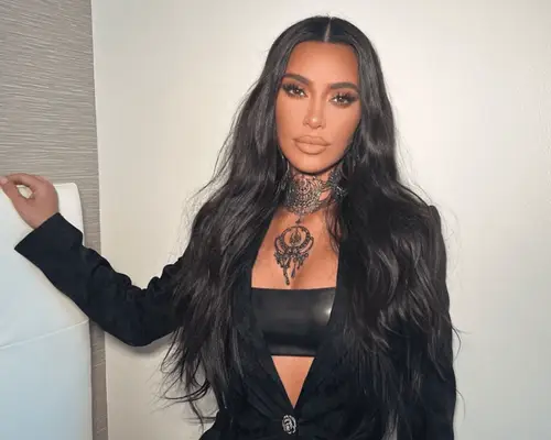 kim kardashian wearing long black hair and black blazer