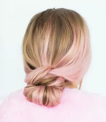 A low bun with pink streaks