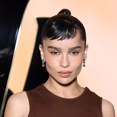 Zoe Kravitz with slicked-back bun and baby bangs