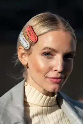 Leonie Hann with multicolor hair clips in low bun