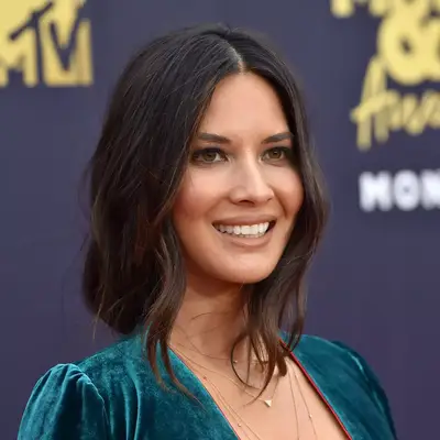 Olivia Munn with tousled low ponytail at the 2018 MTV Movie And TV Awards