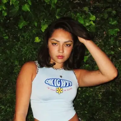 Avani Gregg wears a long bob hairstyle