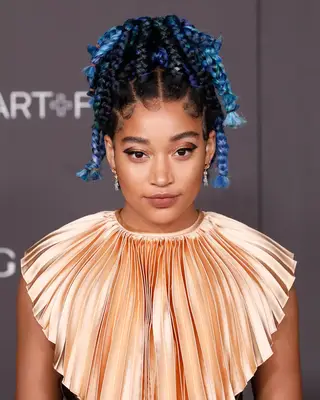 Amandla Stenberg with blue-based black hair.