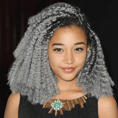 Amandla Stenberg wearing dark gray crimped bob