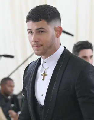 Nick Jonas with a crew cut hairstyle at the 2018 Met Gala in New York City