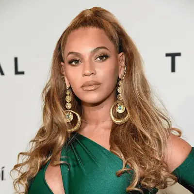 Beyonce with a half up half down high ponytail