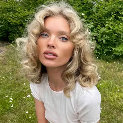 Elsa Hosk with layered curly hair 