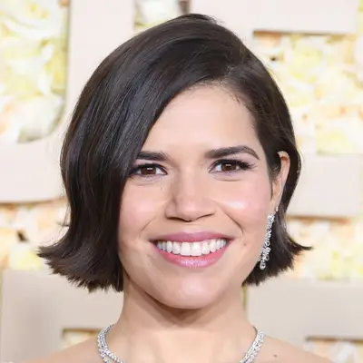 America Ferrera attends the 81st Annual Golden Globe Awards in a deep side part flipped bob and natural makeup