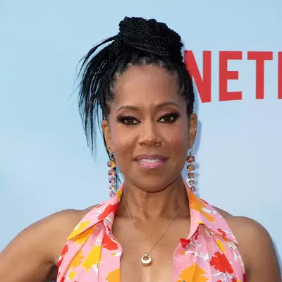 Regina King with braids and a topknot