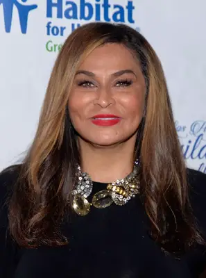 Tina Knowles with long, sun-kissed brown hair on the red carpet