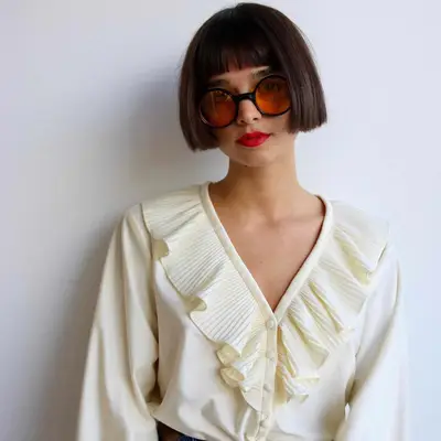 Person with a slick straight French bob