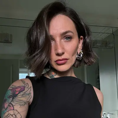 Person with a glossy French bob