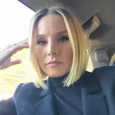 Kristen Bell wears a sleek blonde A-line bob haircut