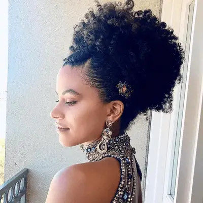 model with loose updo and face framing pieces