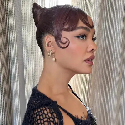tessa thompson wearing bun and swooped bangs