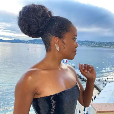 regina king wearing a big bun