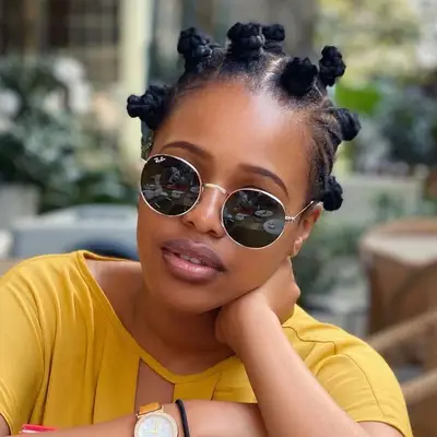 Natasha Thahane wears a Bantu knots hairstyle with braids