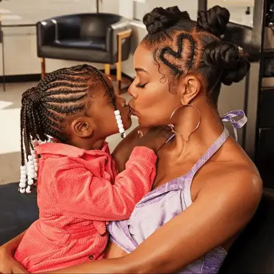 Gabrielle Union with bantu knots and heart-shaped braid with daughter