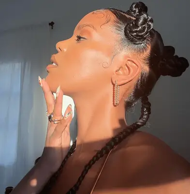 Rahel Brhane with bantu knots and low pigtails